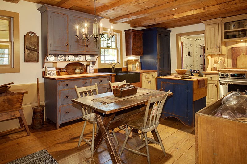 Primitive Colonial Style Reproduction Home With Some Small Kitchen Islands