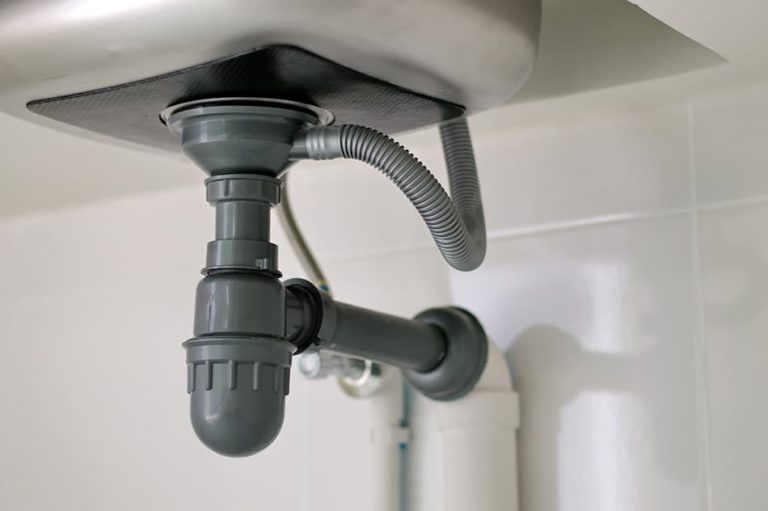 mounting a t trap for kitchen sink withou space