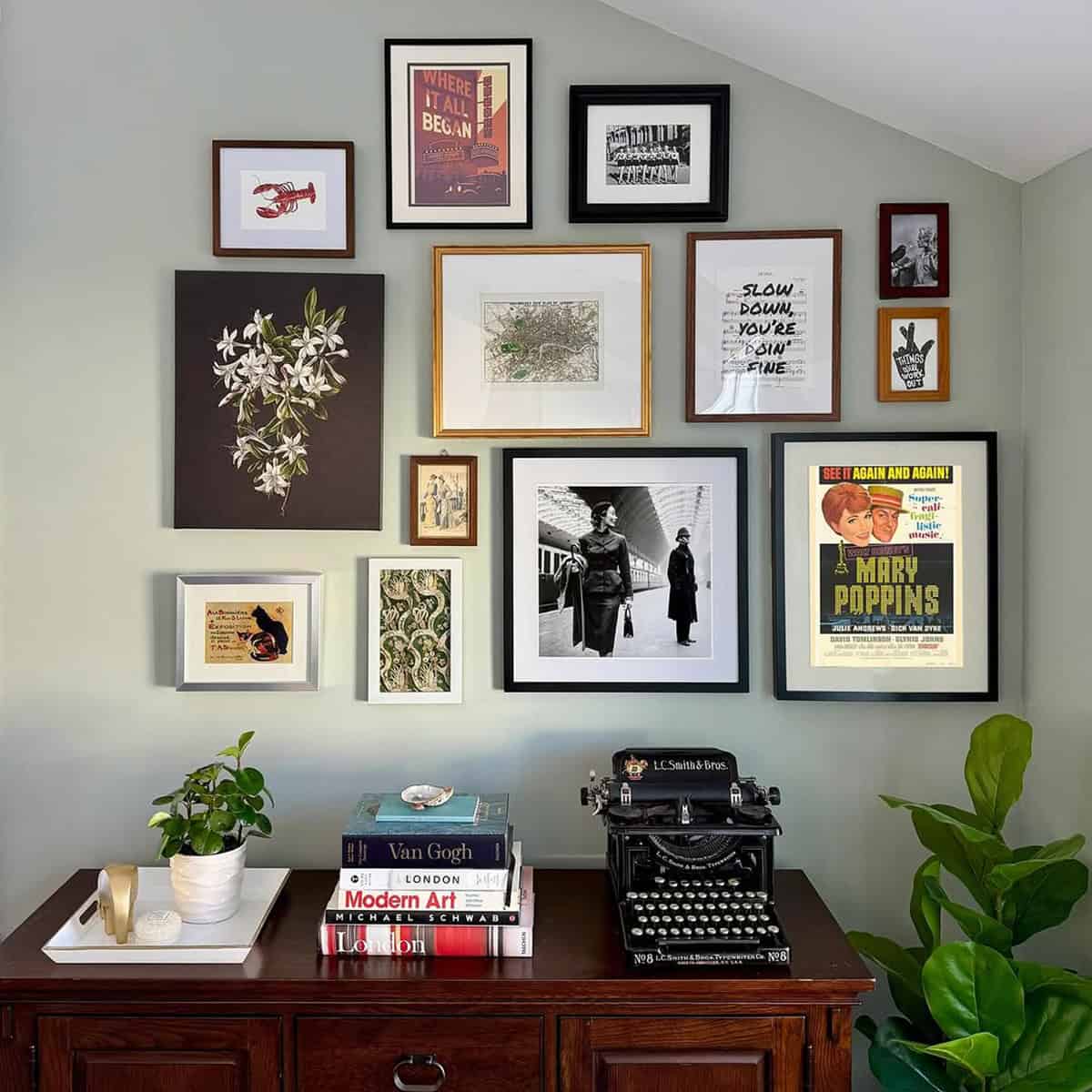 Stylish Photo Wall Above a Desk for a Creative Workspace